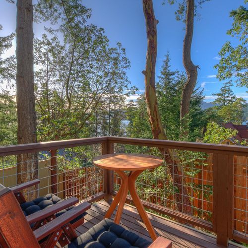 Back deck with bistro table and waterviews.