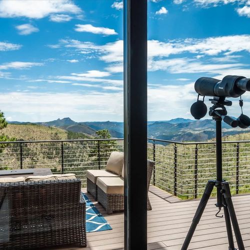 - spot mountain peaks and wildlife with the included telescope by your private deck
- comfortable seating invites you to relax while taking in the endless scenery
- perfect for stargazing, birdwatching, or a peaceful afternoon with a book