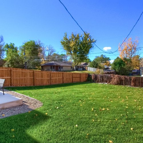 - stylish backyard features a manicured lawn and full privacy fence
- ideal space for yard games, outdoor yoga, or letting the kids run around
- enjoy the peaceful suburban setting and clear blue skies