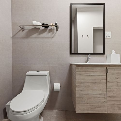 Modern fixtures and sleek lines create a contemporary oasis for your pampering needs
