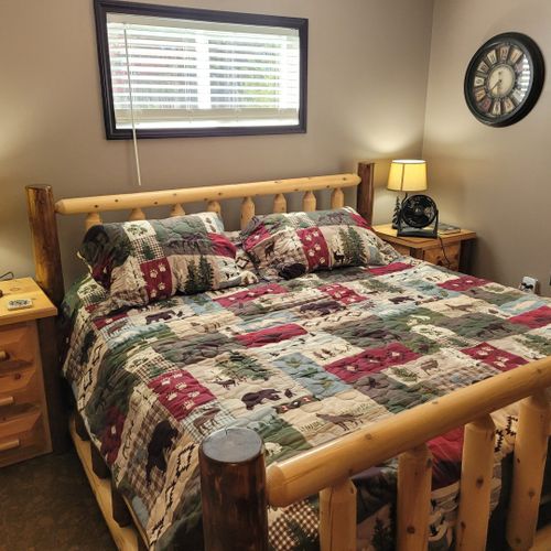Bedroom #1 (second floor):  features a king-size bed, nightstands, lamps, closet, dresser, and ceiling fan.