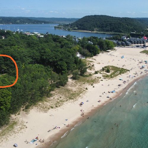 Exterior:  the home is in an incredible location just a short walk from lake michigan, frankfort beach, the frankfort pier and lighthouse, betsie bay, and downtown frankfort!
