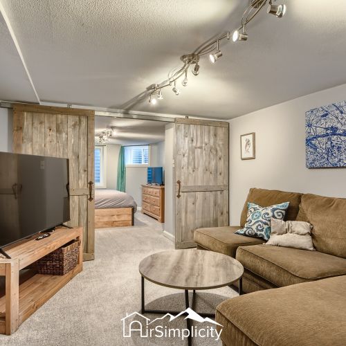 Step inside and experience the warmth and comfort of this rustic suite! Curl up with a good book or watch a movie on the large flat-screen tv.