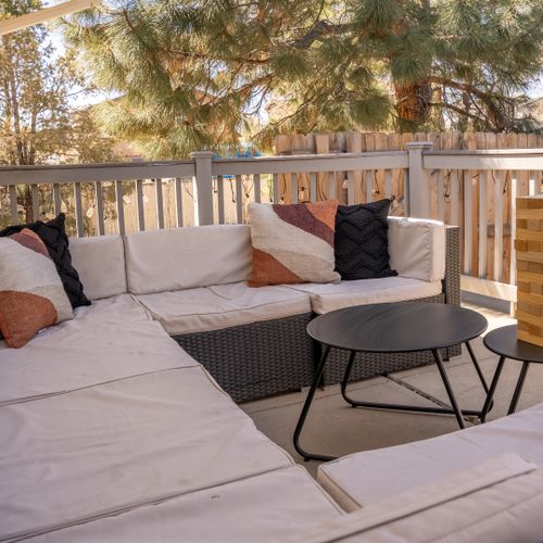 The comfortable terrace sofa provides the perfect, fresh spot to relax and enjoy outdoor games and lounging