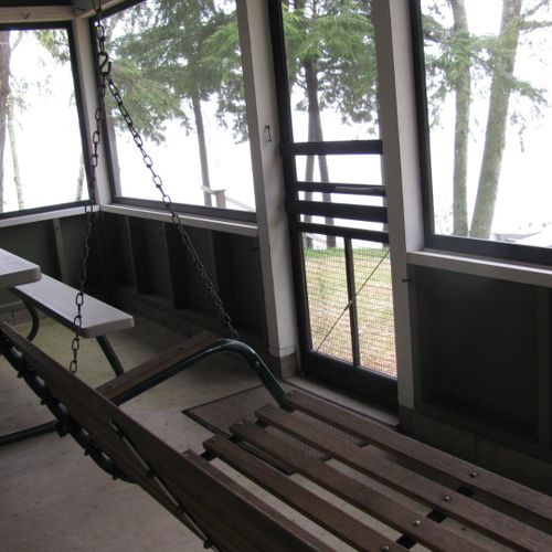 Front porch:  the cabin has a lovely screened-in porch with a picnic table and a great view of little platte lake