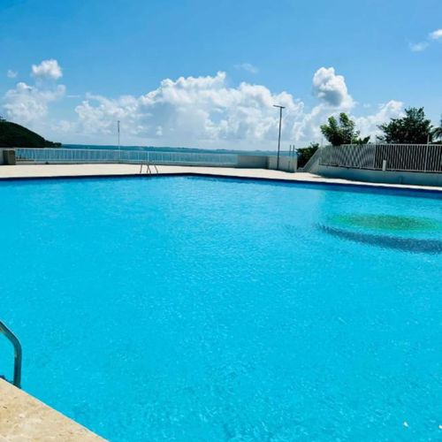Resort-Style Living: Indulge in the luxury of a stunning swimming pool, offering the perfect escape for sunbathing and relaxation.
