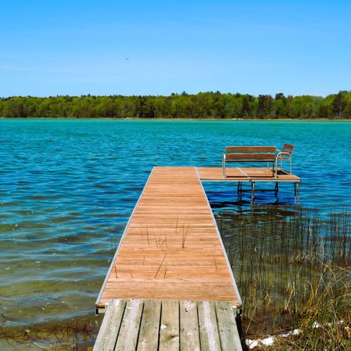 Exterior:  the private dock and the beautiful color of pristine long lake