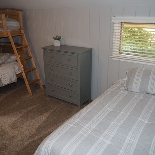 Bedroom #7 (second floor):  has two twin-on-twin bunk beds plus a separate twin bed, thus sleeping 5 people.
