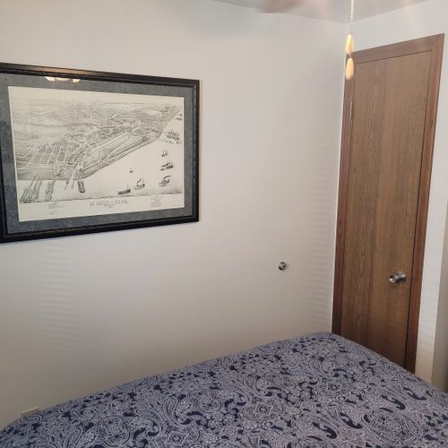 Bedroom #2:  features a full-size bed, ceiling fan, dresser, and closet.