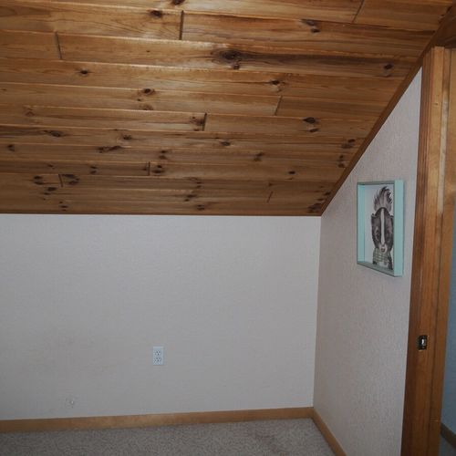 Bedroom #4 (upstairs):  features a twin-on-twin bunk bed, table, and a closet.