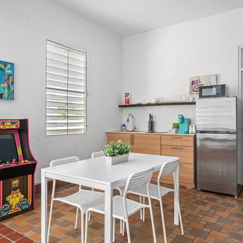 Experience coziness in our charming kitchenette, complete with a timeless arcade game for nonstop fun.