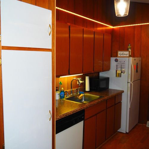 Kitchen:  very convenient and functional galley kitchen with all appliances, including a dishwasher. Includes lots of counter space and a good supply of cooking and dining utensils.