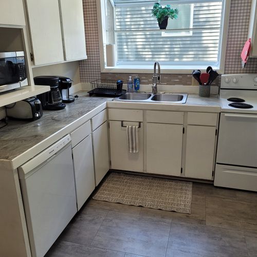 KITCHEN:  Recently updated kitchen with all appliances including a dishwasher and a good supply of cooking and dining utensils.
