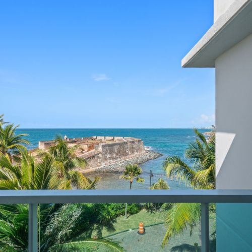 Your private balcony provides a stunning backdrop of the ocean and Condado Lagoon Villas. Perfect for enjoying your morning coffee.