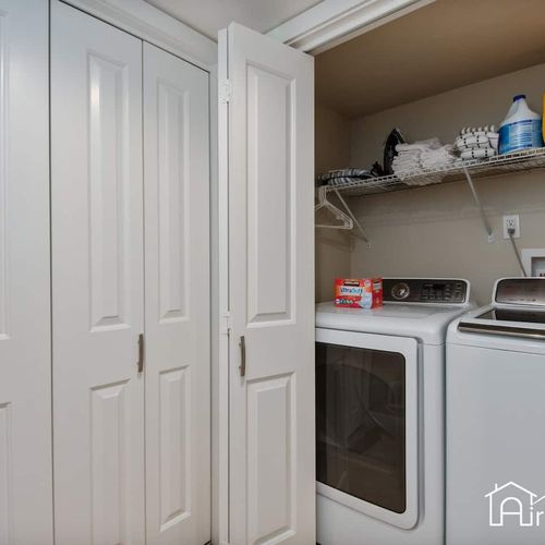 Effortlessly tackle laundry with the full-sized washer and dryer and provided supplies.