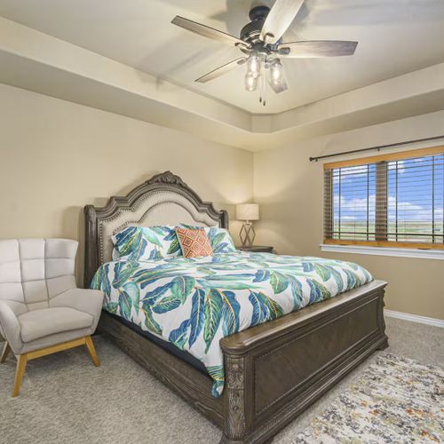 The master bedroom boasts a king bed, ensuite bath, and an airy, luxe vibe for a perfect retreat.