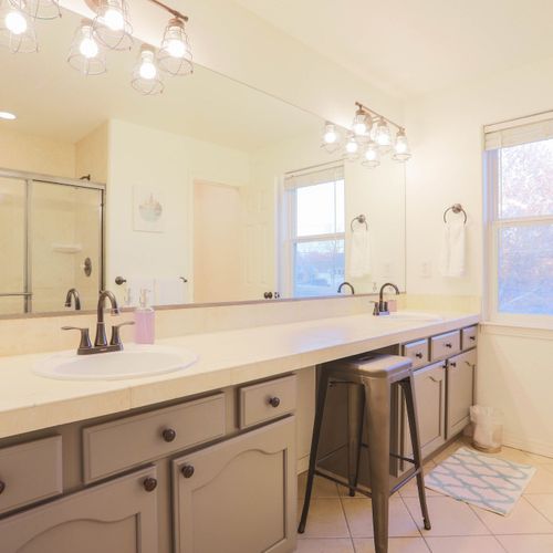 Well-lit double vanities offer plenty of space for morning routines side by side.