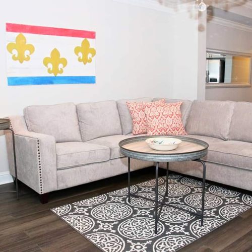 Living room dressed in local New Orleans-inspired décor & soft tones.