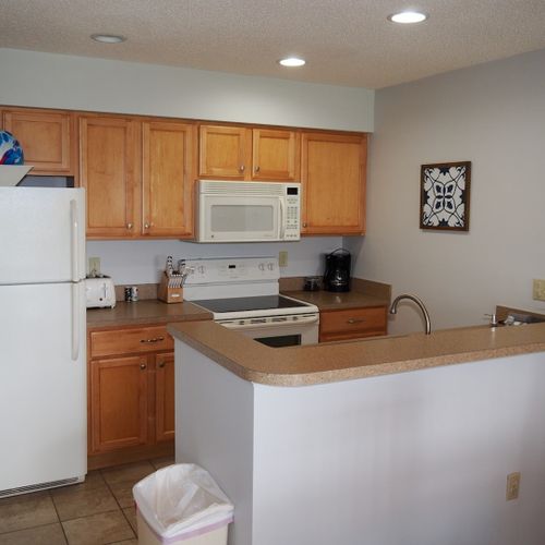 Kitchen:  the condo has a convenient and efficient full kitchen with all appliances including a dishwasher. A good collection of cooking and dining utensils is also included with the rental.