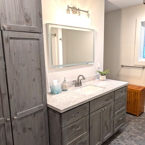 BATHROOM #2 (UPPER LEVEL):  Full bathroom on the top floor (third floor) with a combination tub and shower.  Includes private entrance from the top floor bathroom as well as a washer and dryer in a laundry closet.