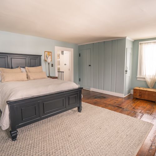 Unwind in this classic farmhouse bedroom.