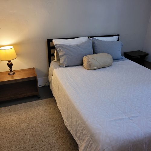 BEDROOM #2 (SECOND FLOOR):  Features a queen-size bed, nightstands, lakeview, and closet.