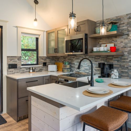 A clean, well-equipped kitchen with everything you need for cooking, coffee, and cozy cabin living.