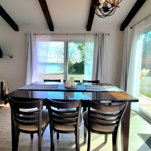 Dining room:  between the kitchen and the living room is a very nice dining area with a table and chairs for 6 along with a great view of crystal lake!