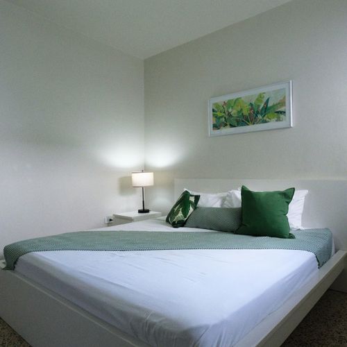 Immerse yourself in the calming atmosphere of this bedroom. The soft lighting and comfortable furnishings create an ideal setting for unwinding after your day's adventures.