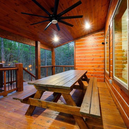An outdoor dining area can be found on the covered patio!