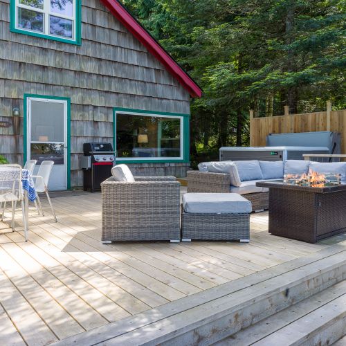 Cedar decking includes the hot tub, dining and lounging area and a lower deck for sun bathing.