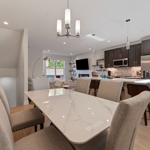 Enjoy the open layout, where the kitchen’s high-end appliances and the dining table’s relaxed style make every moment easy.