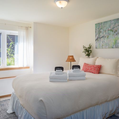 Guest Bedroom with garden views and quiet space set apart from the upstairs common area.