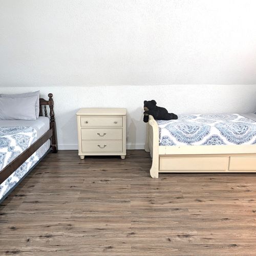 BEDROOM #4 (UPPER LEVEL):  Features 3 trundle beds, which are single beds with a second single bed that rolls out from underneath.  As such, the bedroom effectively has 6 single beds.