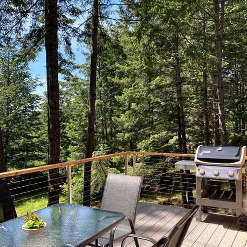 Al fresco dining among the firs — your elevated deck is the best seat on Orcas Island.