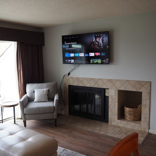 Living room:  features a sofa, comfy chair, ottoman, large screen television, and a desk and chair. (note that guest usage of the fireplace in the living room is strictly prohibited. )