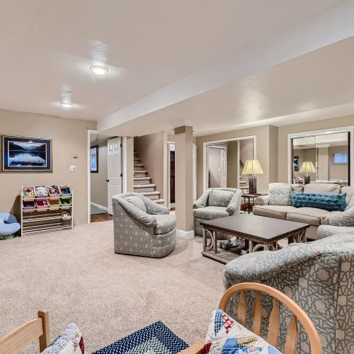 Another cozy living room with plenty of comfortable seating. Here you will find some board games and some children's toys.
