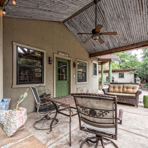 Outdoor seating on the porch area of the Cottage