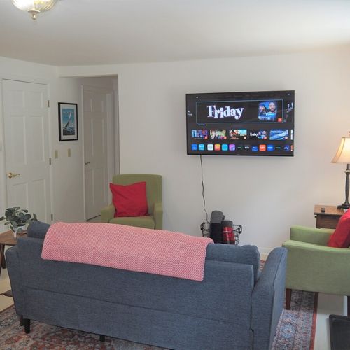 Living room:  very comfy living room with a large television with live streaming.