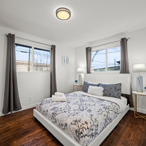 The second upstairs bathroom features a queen size bed and large windows that let in tons of natural light!