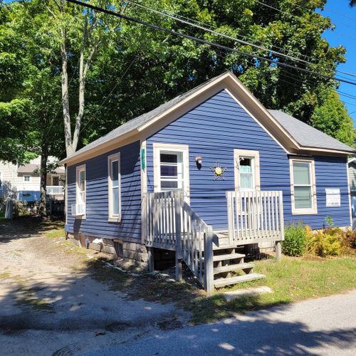 EXTERIOR:  The front of the house from the side.