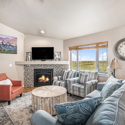 Cozy living room with a gas fireplace—your go-to spot for instant comfort and calm.