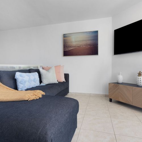Discover comfort and charm in our beautifully appointed living space. Perfect for unwinding, this room offers a cozy ambiance for your relaxation.