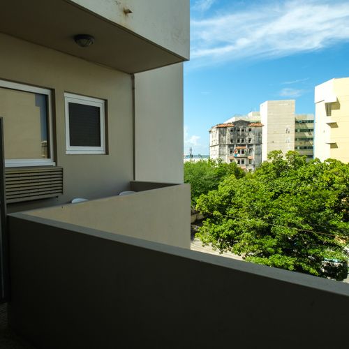 Private Balcony View. Enjoy fresh air and the urban vista of San Juan.