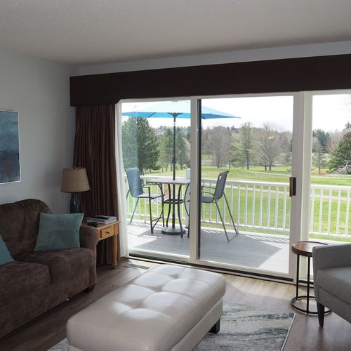 Living room:  features a sofa, comfy chair, ottoman, large screen television, and a desk and chair. (note that guest usage of the fireplace in the living room is strictly prohibited. )