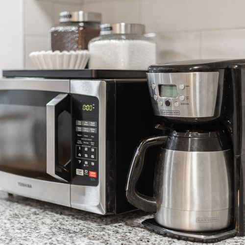 The kitchen is equipped with coffee, tea and other cooking essentials.