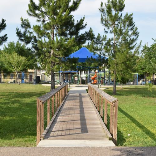 A scenic walkway leads straight to Lafitte Greenway Park.