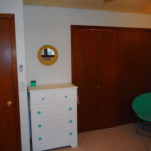 Bedroom #2:  features a full-size bed, bunk bed (i. E. 2 single beds on top of each other), ceiling fan, dresser, mirror, and closet.