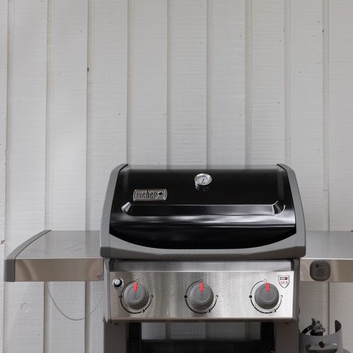 A gas BBQ with BBQ tools is provided.  Just bring your secret sauce!