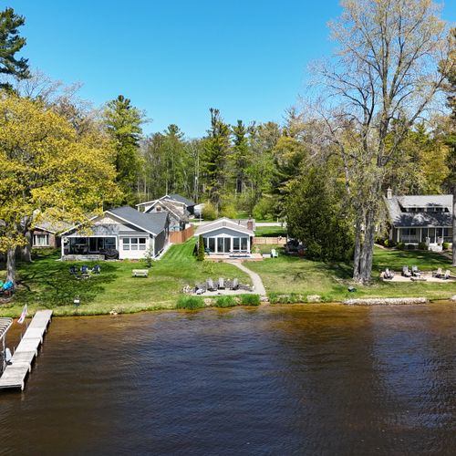 Overall:  a front view of the house with the lake